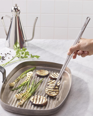 Superyacht galley cooking on a pan